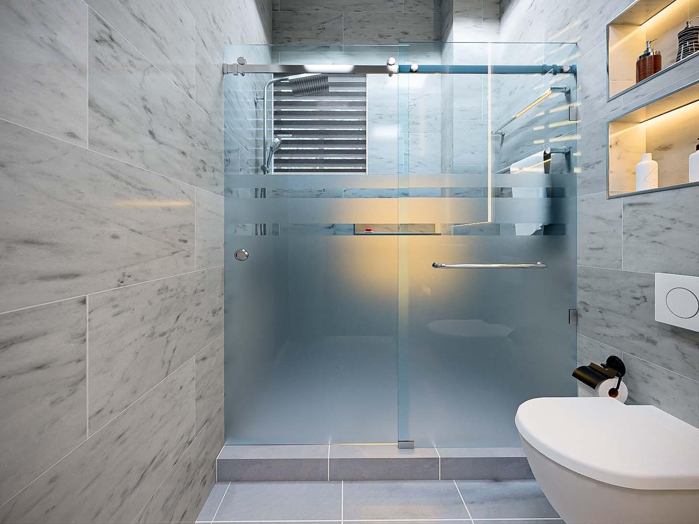 Walk-in shower behind frosted glass, with marble walls and lit shelving