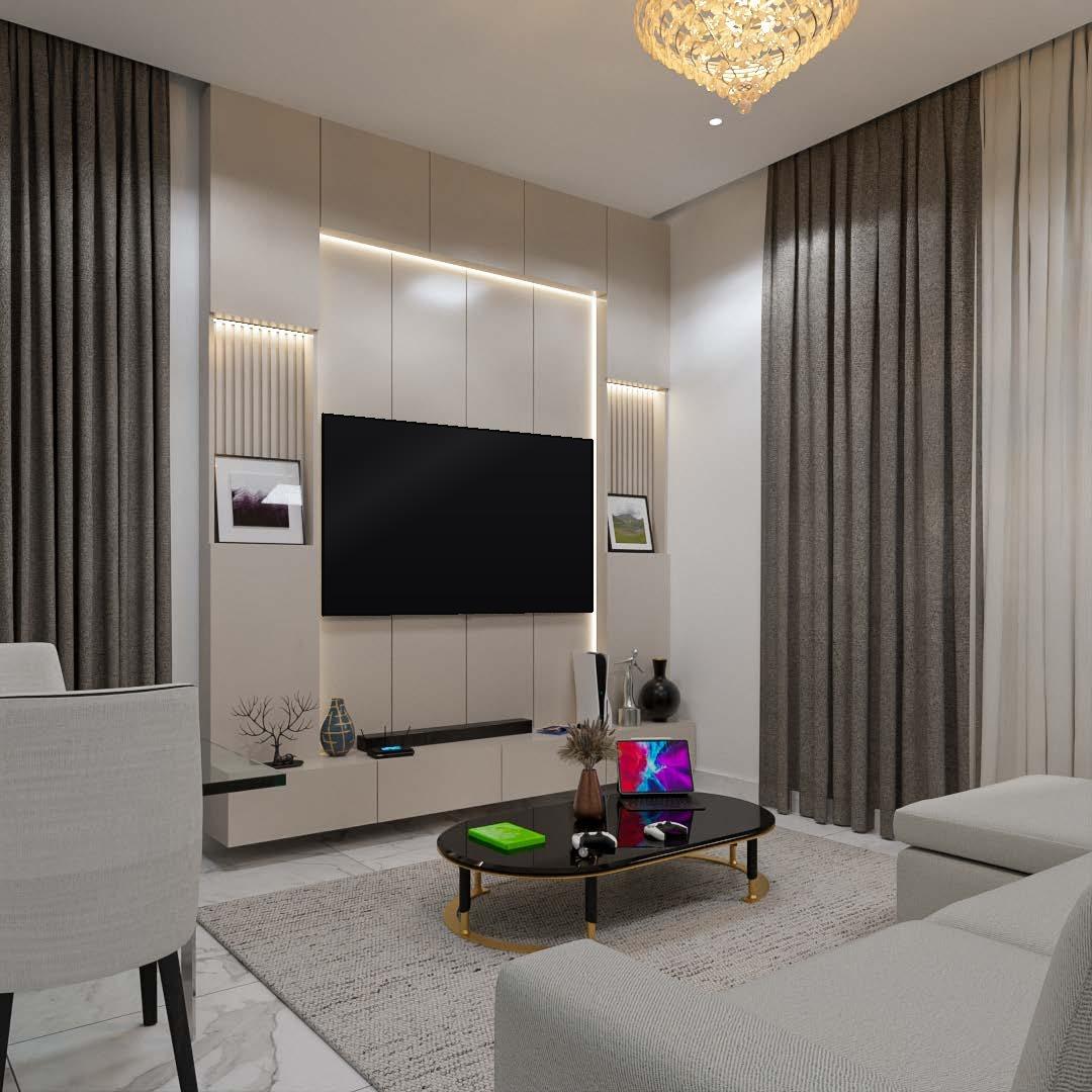 Living room with a softly lit feature wall, grey drapes and a crystal pendant