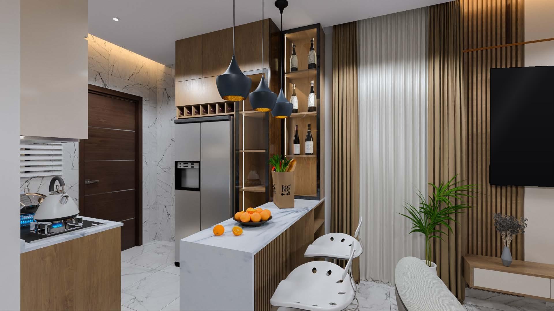 Kitchen island with bar stools, a stainless-steel fridge-freezer and walnut cabinetry